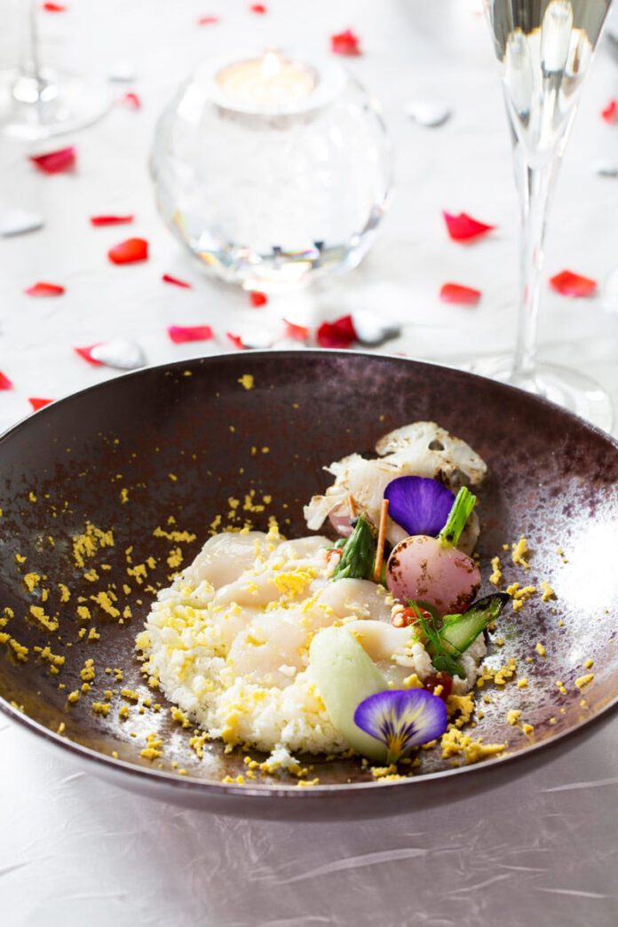 Scallop Carpaccio with Cauliflower Caviar, Green Apple Ice Cream, Horseradish, Russian Egg and a Vinaigrette of Roasted Nuts