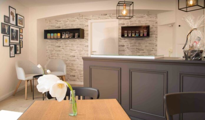 Cozy reception area with modern decor and flowers.