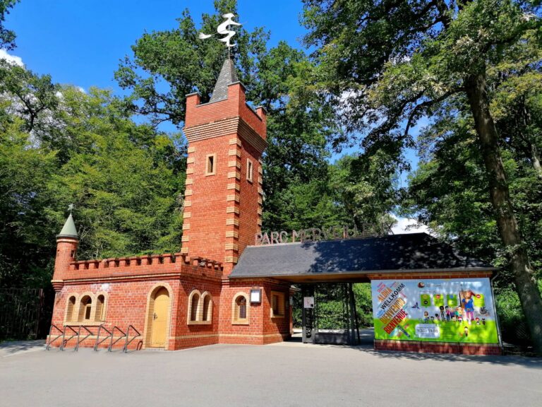 Entrance to Parc Merveilleux with brick tower.
