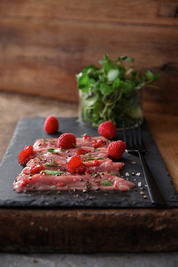 Veal carpaccio with raspberry vinaigrette