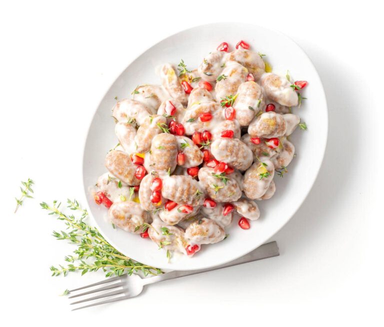 Chestnut gnocchi with parmesan sauce & pomegranate seeds