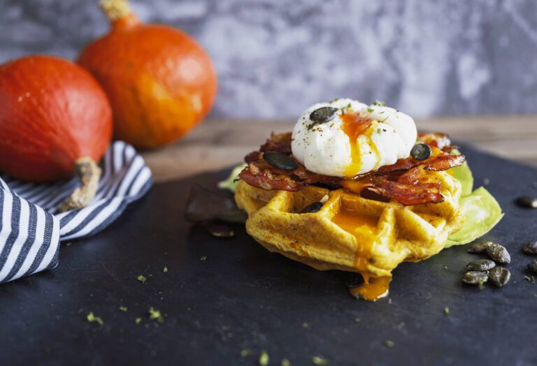 Pumpkin waffle topped with poached eggï¿¼