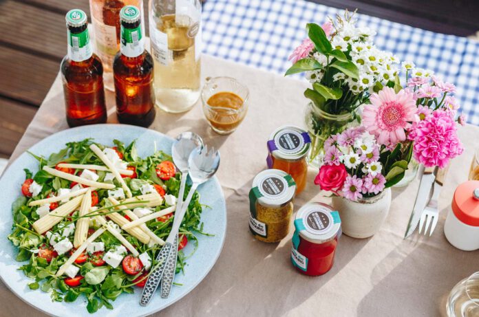 Moutarderie de Luxembourg outdoor table setting with sauce and dish.