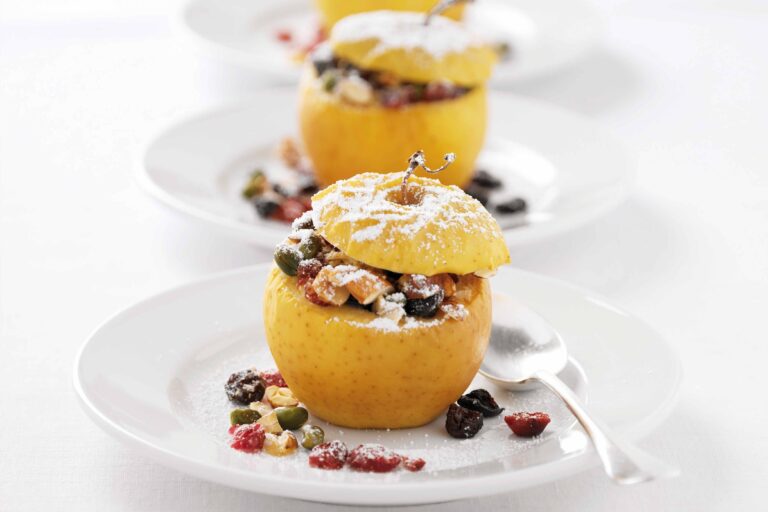 Baked apple with nuts and powdered sugar