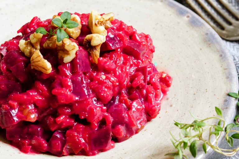 Beet risotto with walnuts and fresh herbs.