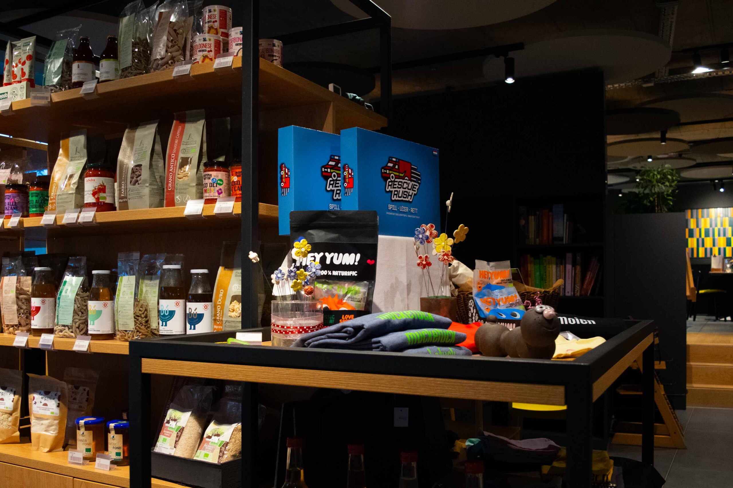 Grocery store shelves with various products displayed.