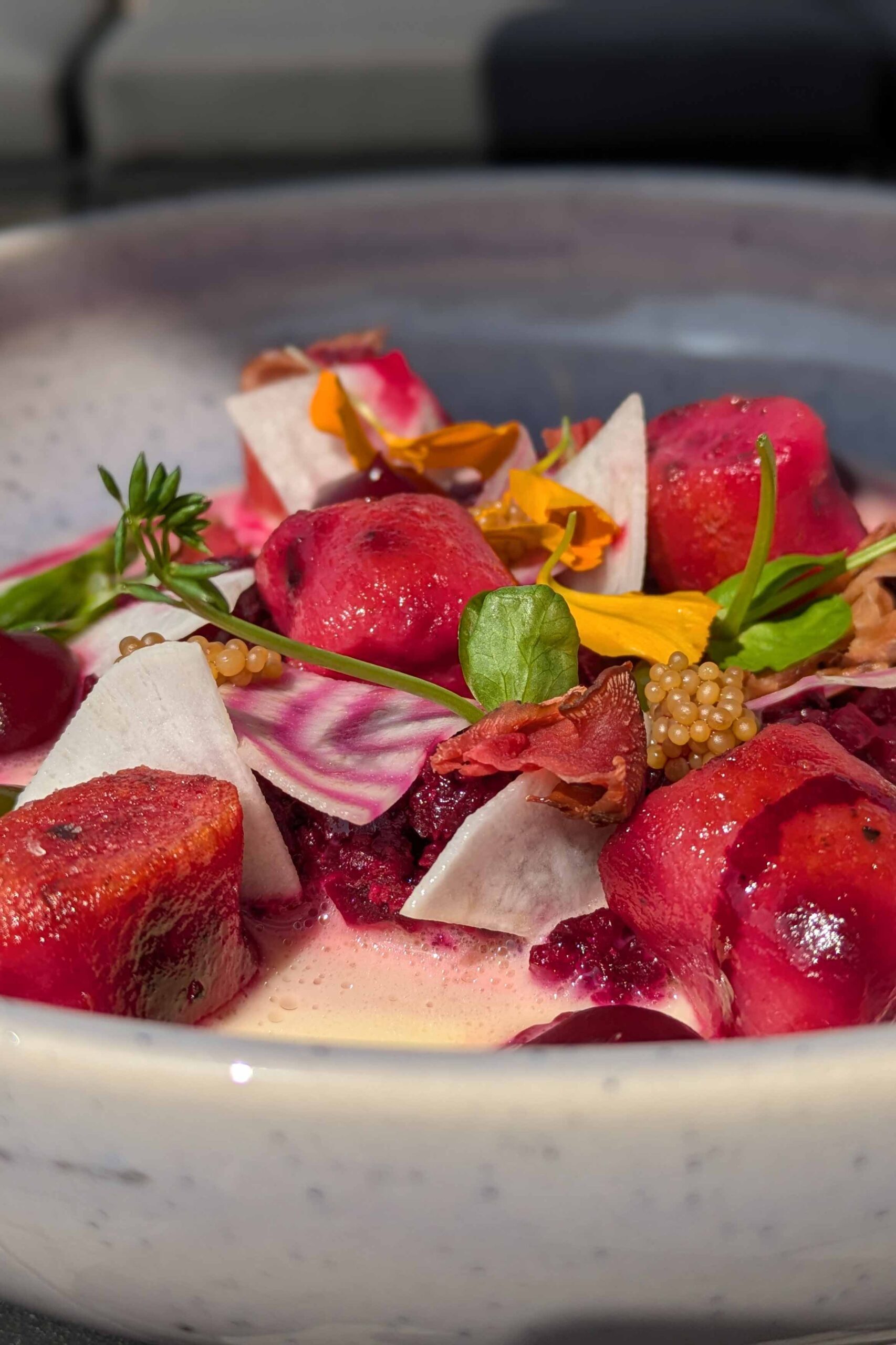 Colorful beetroot salad with flowers and vegetables.