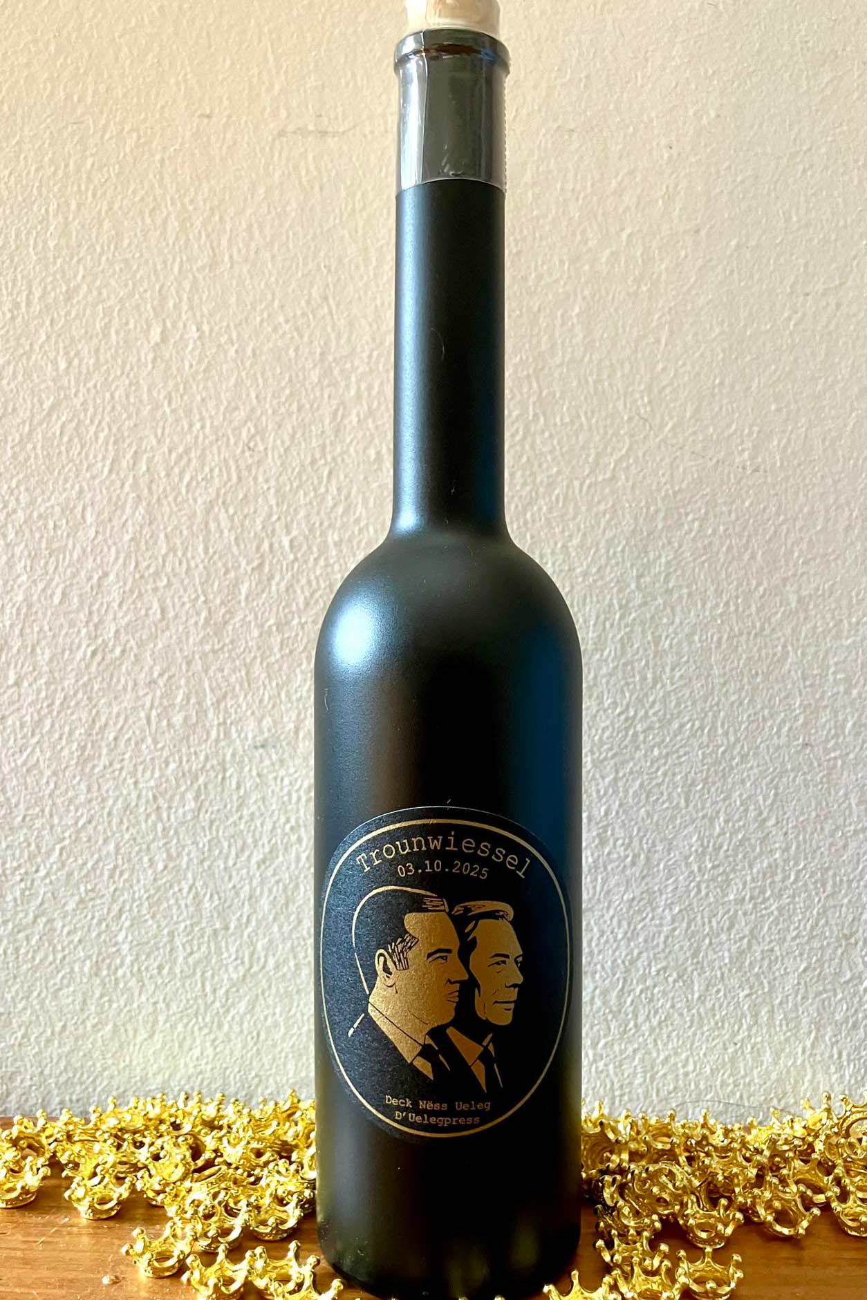 Black bottle with two men's faces label.