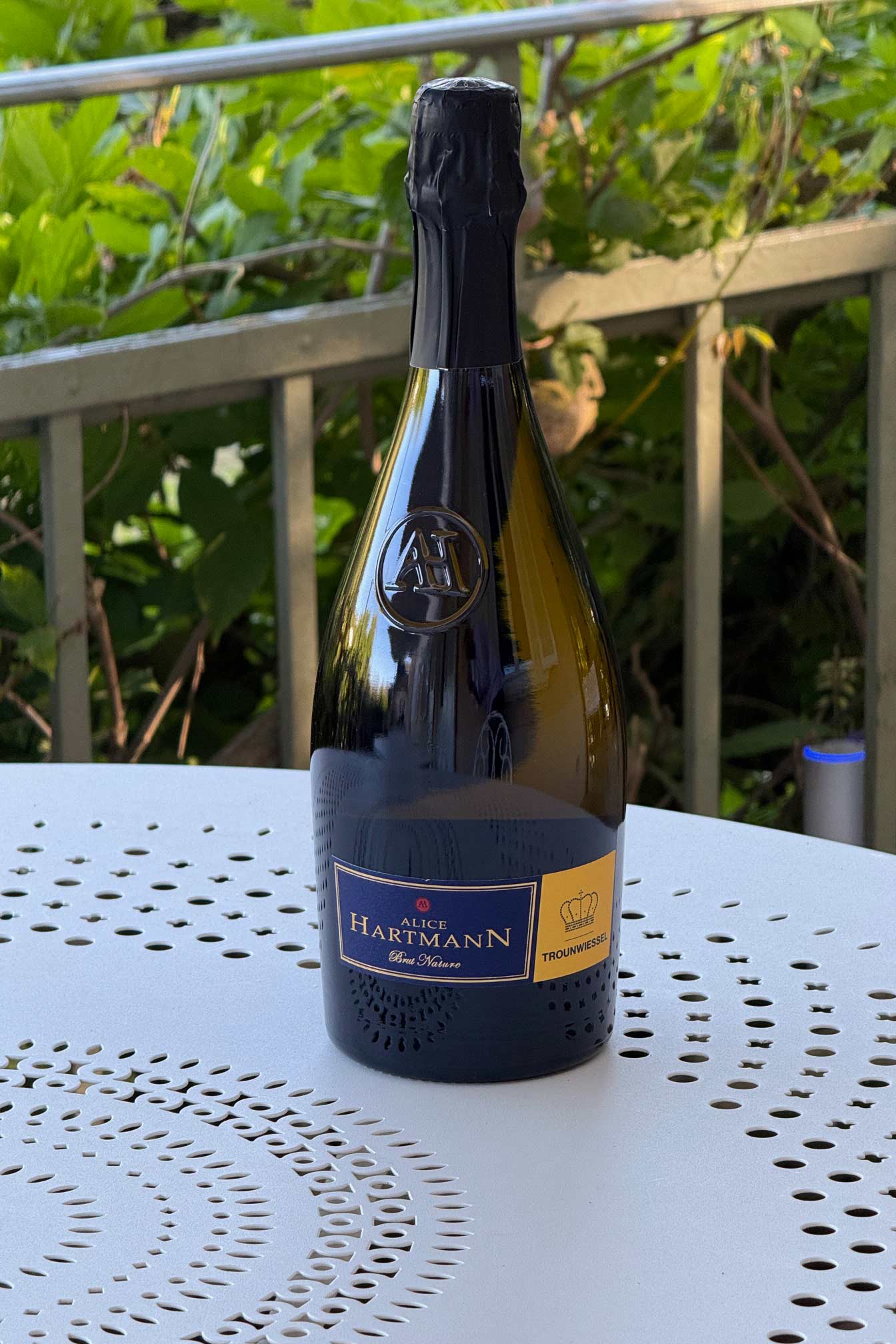 Bottle of sparkling wine on a table.