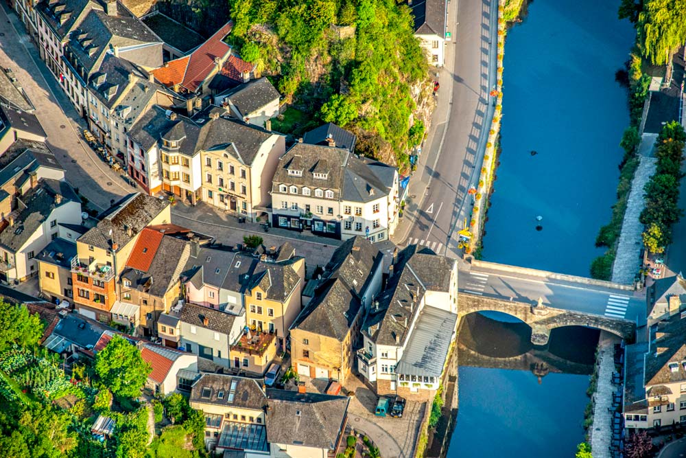 Aerial view of a European village with bridge.