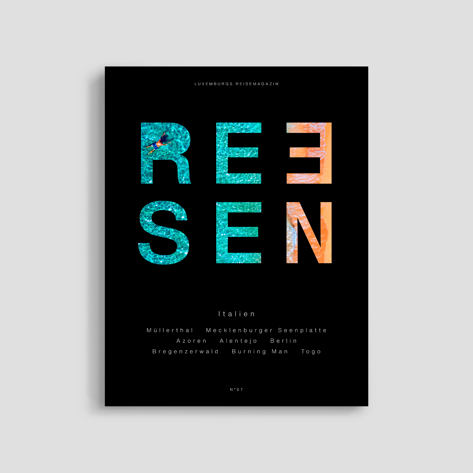 Travel magazine cover with colorful text design.