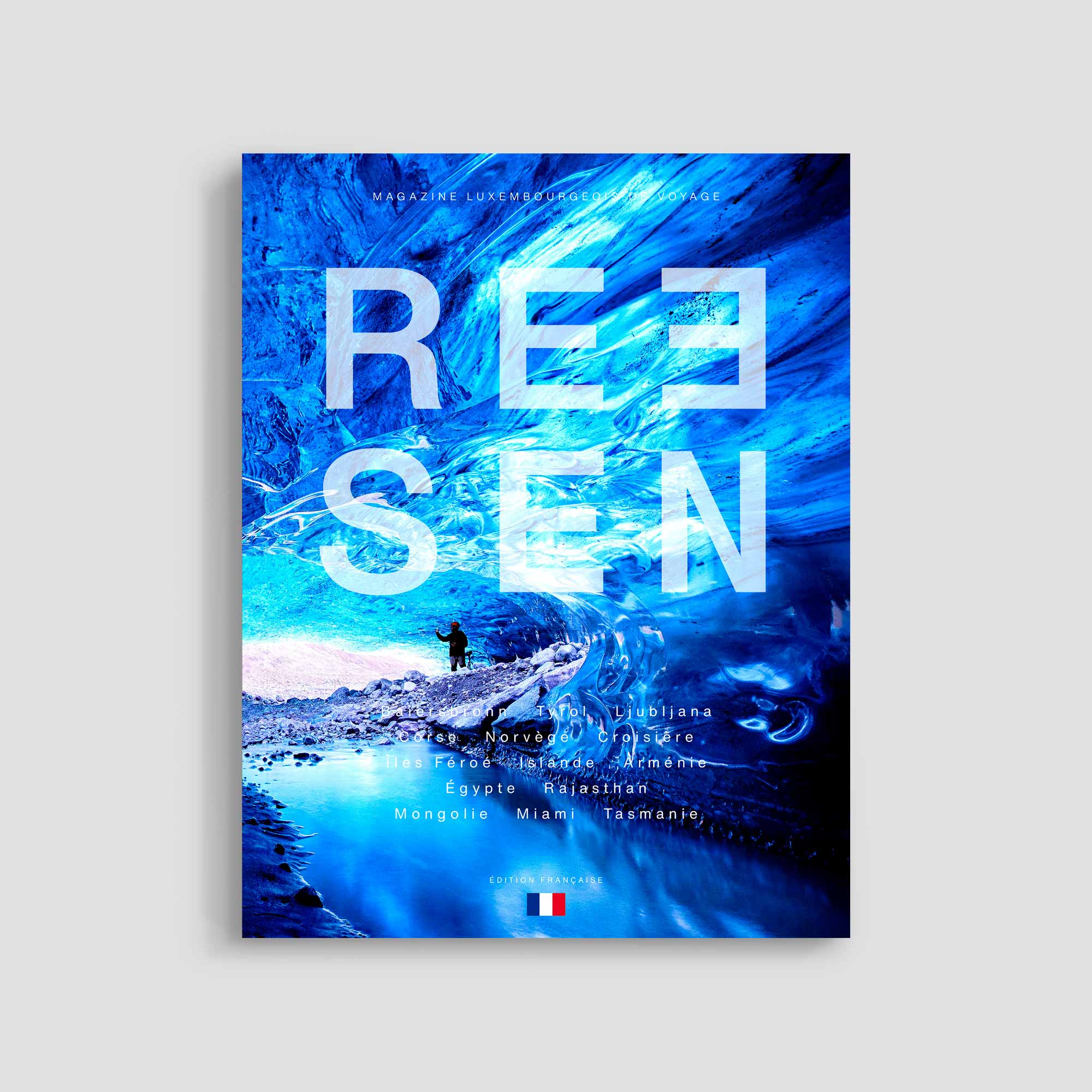 Magazine cover with ice cave and traveler.