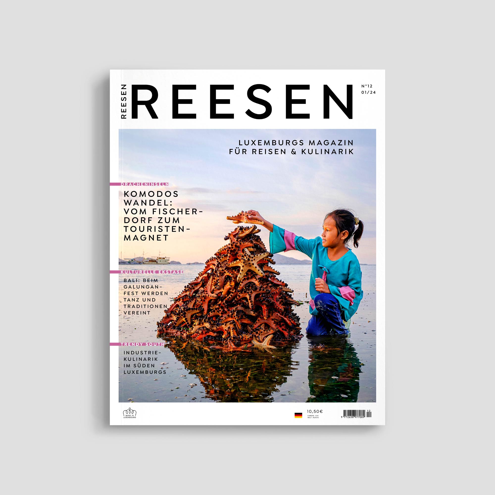 Girl stacking starfish on beach for magazine cover.
