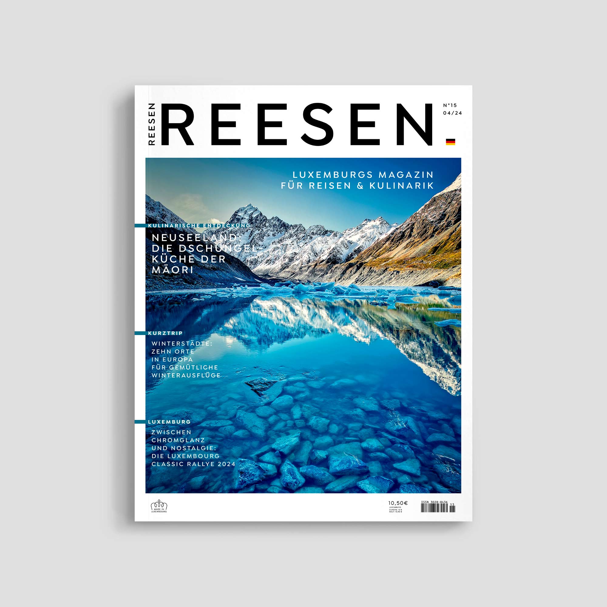 Luxembourg travel magazine cover with mountain lake image.