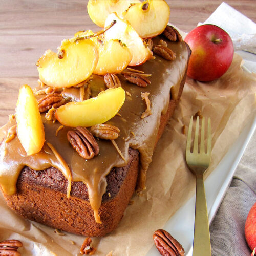 Caramel apple cake with pecans on table