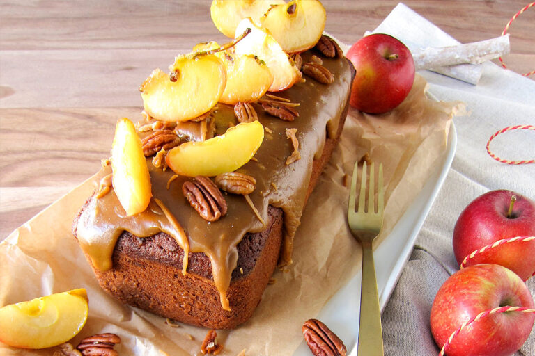 Caramel apple cake with pecans on table